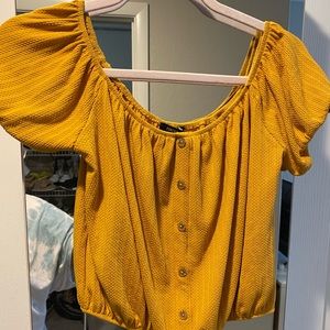 Mustard colored off the shoulder crop top